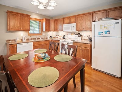 Good Samaritan Society Sioux Falls Village, Nursing Home in Sioux Falls, SD — Modern kitchen with wooden cabinets and dining table