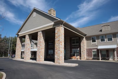 Front entrance of Forest Hills Commons with stone columns