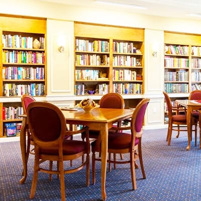 Bright interior of a library with tables and shelves