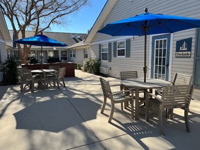 Outdoor seating area with blue umbrellas