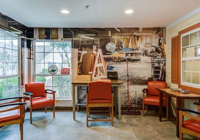 Interior common area with seating and art supplies