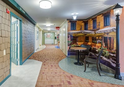 Bright hallway with decorated walls and seating area