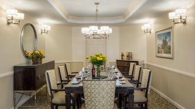 Elegant dining room setup with flowers and stylish decor
