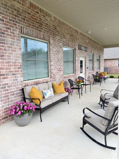 Outdoor seating area with potted flowers