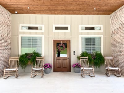 Entrance of a senior care facility with rocking chairs