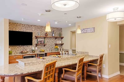 Interior view of a communal kitchen area with a bar