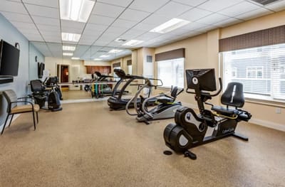 Interior view of a physical therapy room with exercise equipment