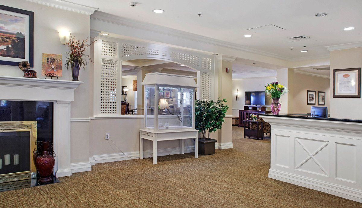 Interior view of a common area with a fireplace and seating