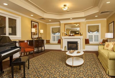 Cozy common area with seating and a piano