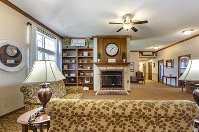 Comfortable common area with seating and a fireplace