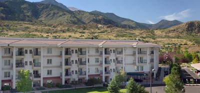 Building exterior of Brookdale Skyline with mountains in background
