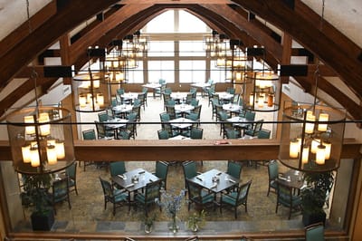 Interior dining area with tables and lighting fixtures
