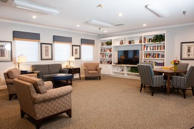 Bright common area with seating and bookshelves