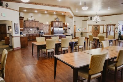 Bright dining area with wooden tables and chairs