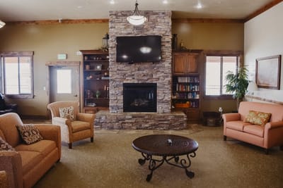 Cozy common area with seating and a fireplace