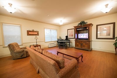 Cozy common area with seating and television