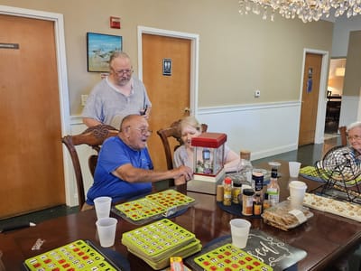 Residents enjoying bingo in a communal area