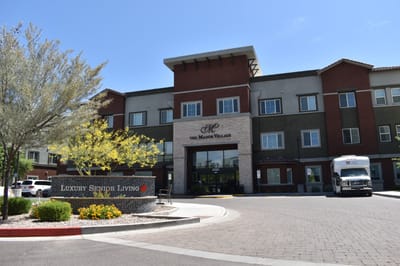 Exterior view of Manor Village at Desert Ridge with sign