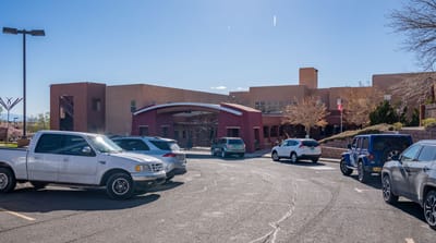 Front view of The Montecito Santa Fé building and parking