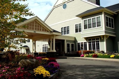 Exterior view of the facility entrance with flowers