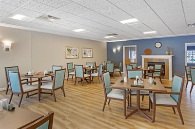 Dining area with tables and chairs in a warm setting