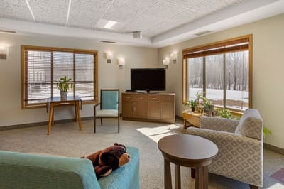 Bright common area with seating and natural light