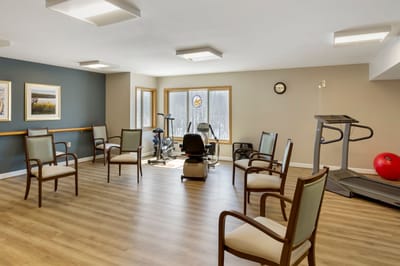 Interior fitness area with exercise equipment and seating