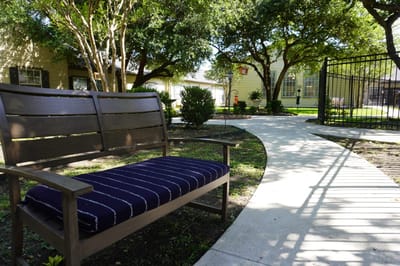 Garden area with a bench and pathway