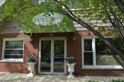 Front entrance of Elmwood Terrace with planters