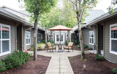 Outdoor courtyard with seating and greenery