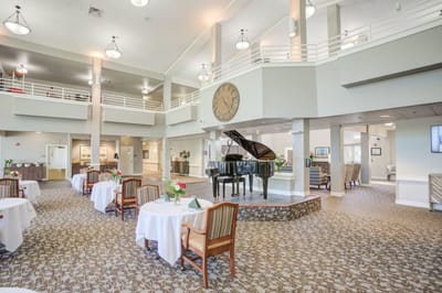 Bright interior dining area with a piano