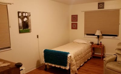 A cozy private room with a bed and decor