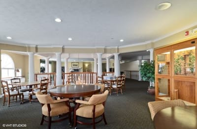Interior of a common area with tables and chairs