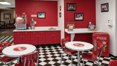Brightly decorated interior space with red accents