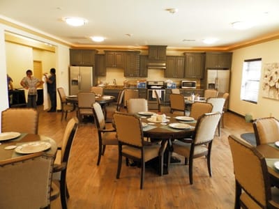 Dining room setup with tables and staff members