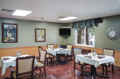 Dining area with tables and artwork on the walls