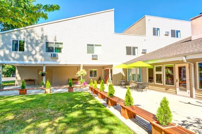 Outdoor space with benches and garden features