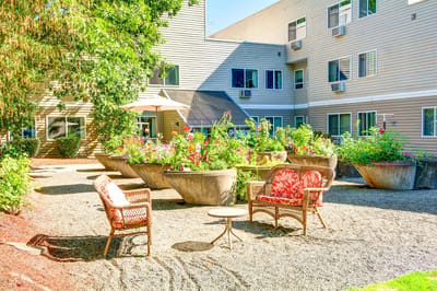 Outdoor garden seating area with flowers