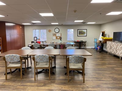 Bright interior of a common area with tables and chairs