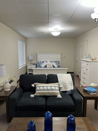 Cozy resident room with a couch and a bed
