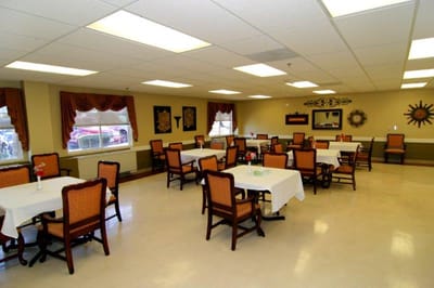 Dining area with tables and chairs in a spacious setting