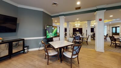 Dining area with tables and chairs in a spacious interior