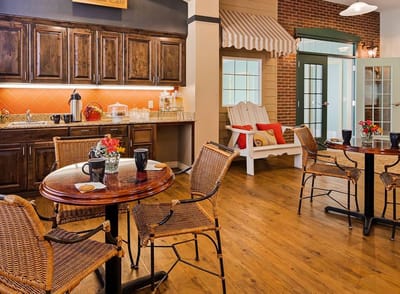 Cozy dining area with wooden tables and chairs
