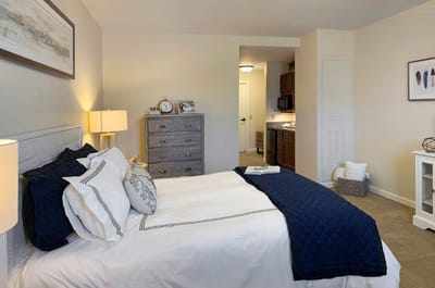 Cozy resident room with a bed and kitchenette