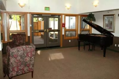 Interior view of a common area with a piano