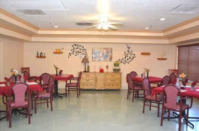 Bright dining room setup with red tables and chairs