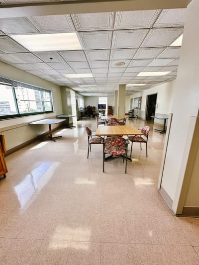 Interior view of a common area with chairs and tables