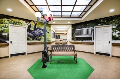 Interior common area with a bench and landscaped walls