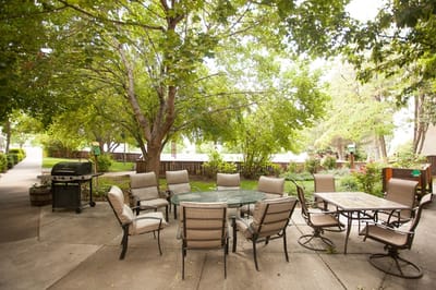 Outdoor seating area with tables and chairs