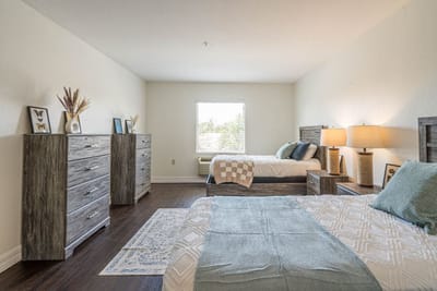 Well-furnished bedroom in an assisted living facility